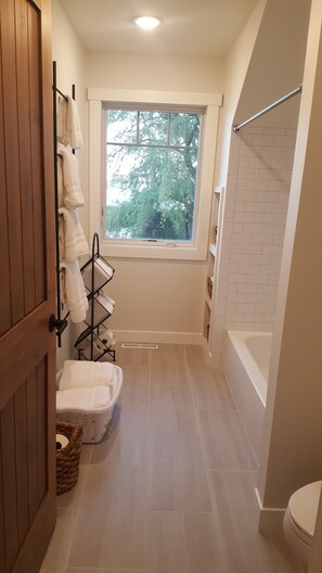 Combined shower/tub, hair dryer, towels, soap