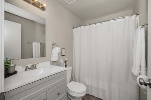 Bathtub, hair dryer, towels