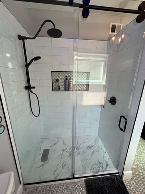 Bathtub, hair dryer, towels, soap