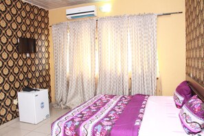 Minibar, desk, bed sheets