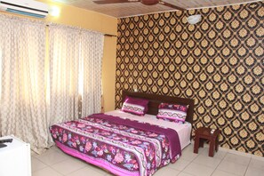 Minibar, desk, bed sheets