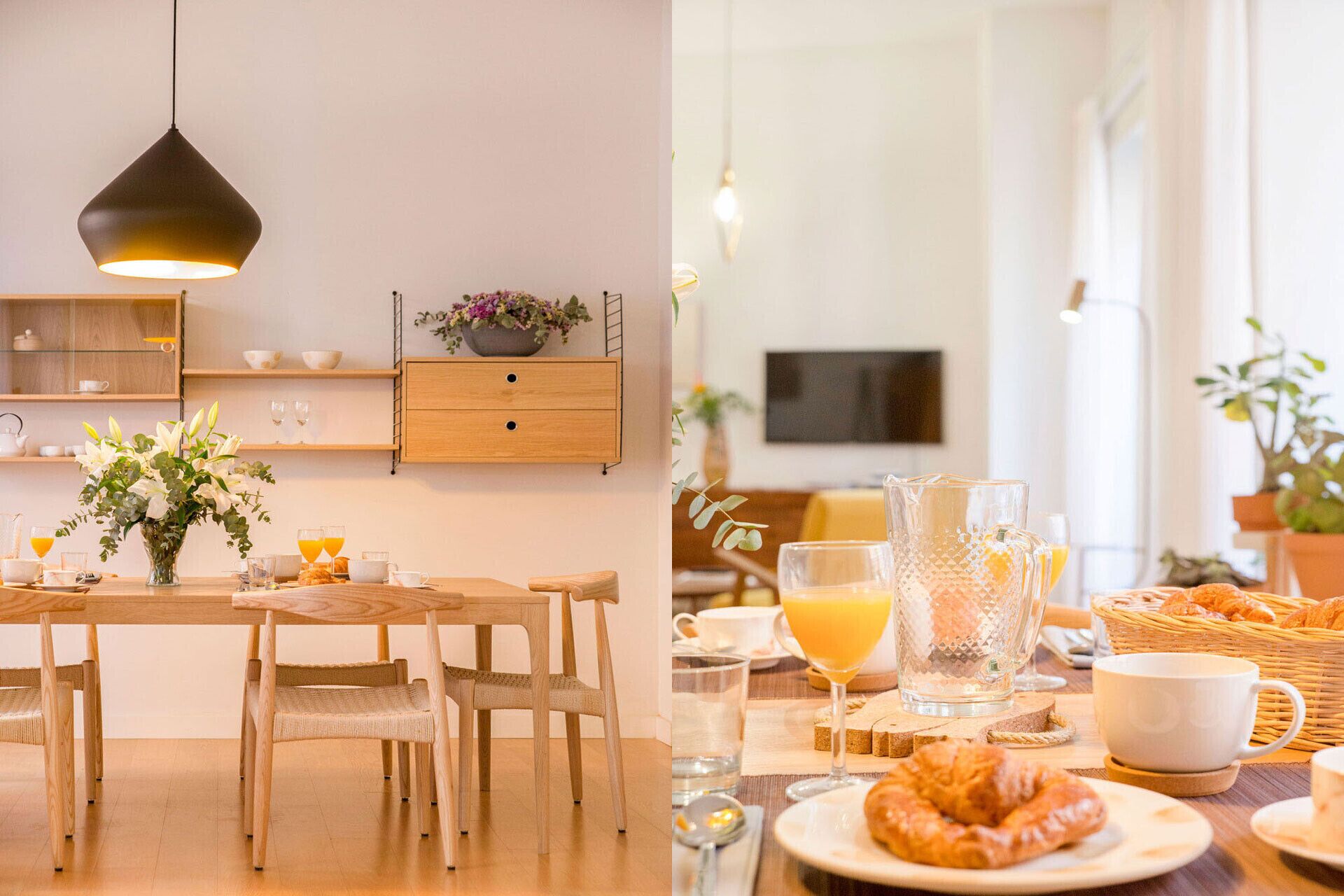 A breakfast setting with a wooden table, chairs, a vase of flowers, and a variety of breakfast items including croissants, juice, and coffee.