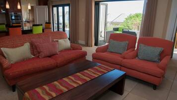 Deluxe House, 5 Bedrooms, Non Smoking, Partial Ocean View | Living area | Plasma TV, fireplace