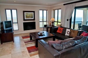 Deluxe House, 4 Bedrooms, Non Smoking, Sea View | Living area | Plasma TV, fireplace
