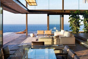 Elite Villa, 4 Bedrooms, Non Smoking, Sea View | Living area | Plasma TV, fireplace - 3 The Cove (Knysna)