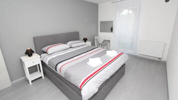 Apartemen, 2 kamar tidur | 2 kamar tidur, setrika/meja setrika, Wi-Fi gratis, dan seprai linen