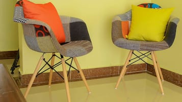 Comfort Triple Room, 3 Bedrooms | Living area | Flat-screen TV