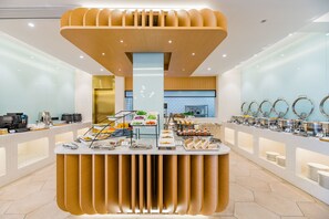 A modern breakfast buffet with a central serving area, multiple food stations, and a clean, contemporary design. - Atour S Hotel Lujiazui Oriental Pearl Shanghai (Shanghai)