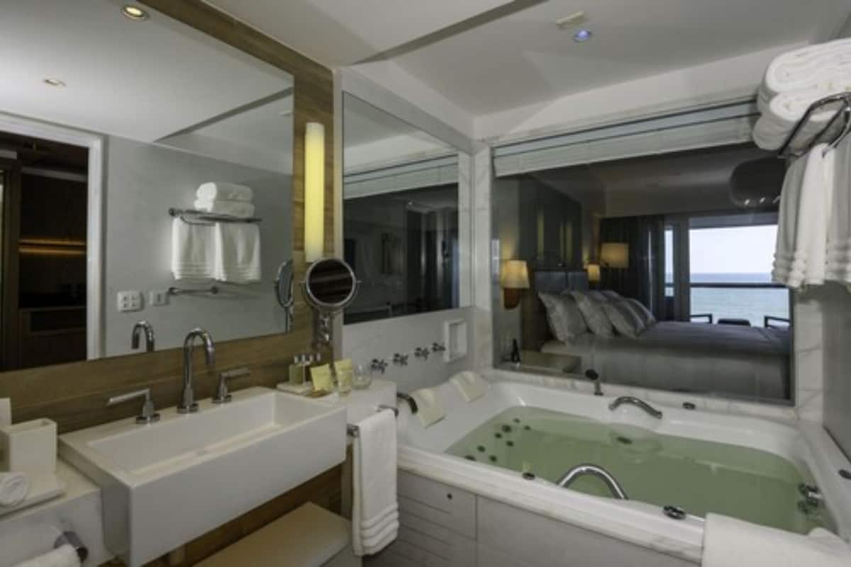combined shower/bathtub, jetted bath, hair dryer, bathrobes