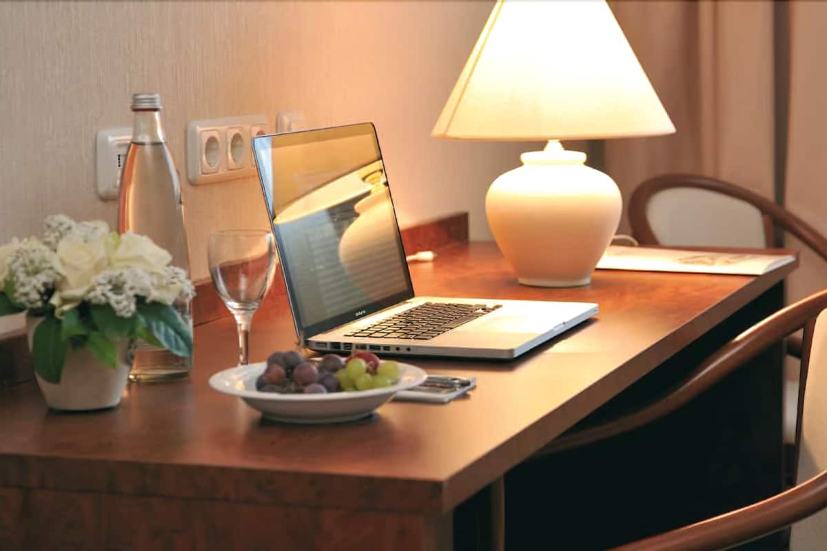 Desk, blackout drapes, cribs (free), WiFi (free)
