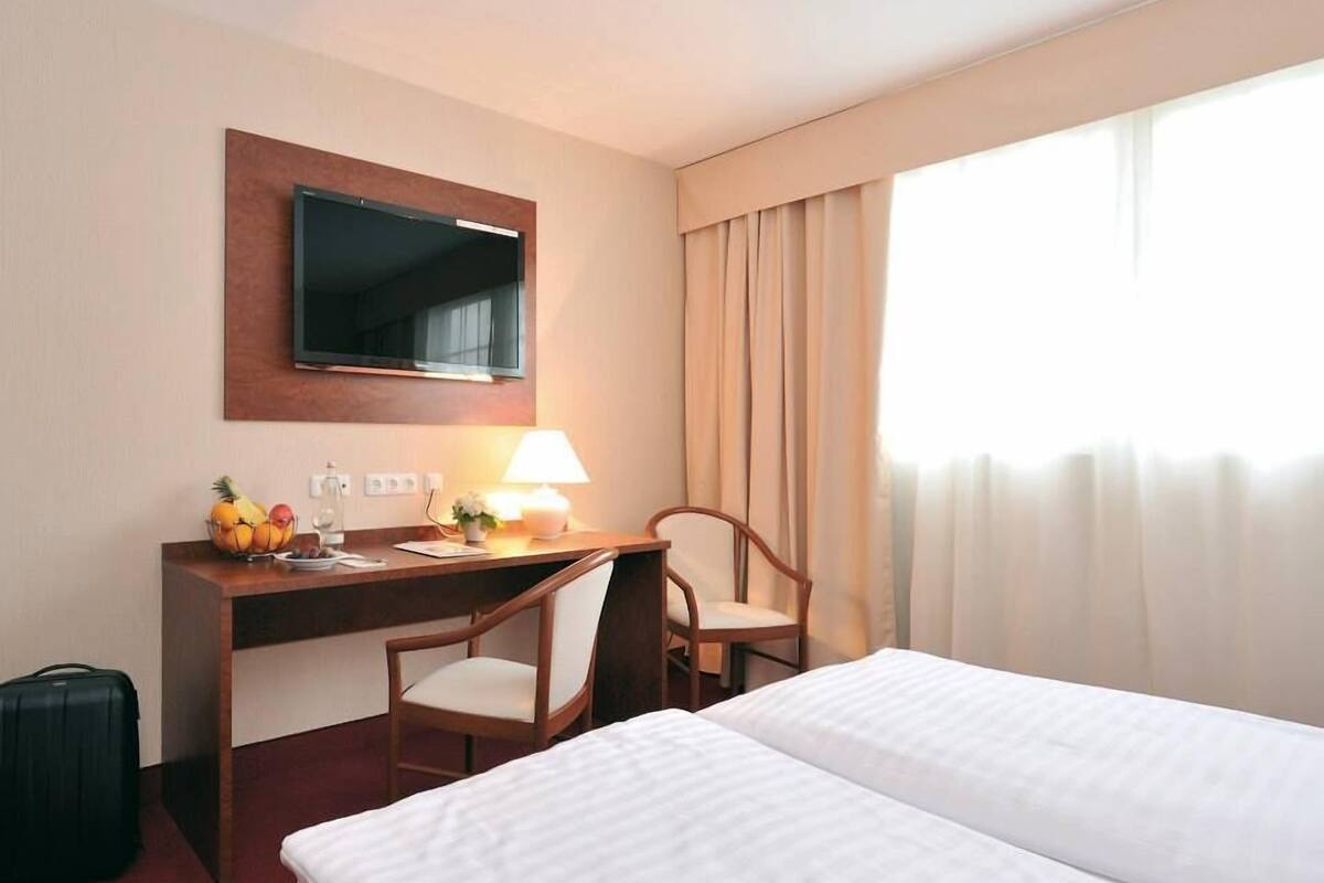 Desk, blackout drapes, cribs (free), WiFi (free)