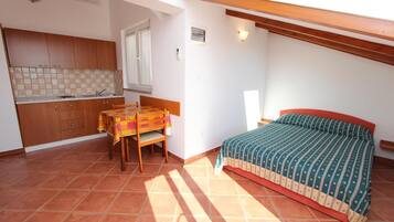 Studio, 1 Double Bed | Living area | Flat-screen TV