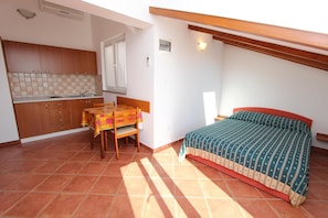 Studio, 1 Double Bed | Living area | Flat-screen TV