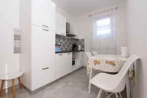 Comfort Apartment, 1 Bedroom (Nona) | Private kitchen | Fridge, stovetop, coffee/tea maker, electric kettle