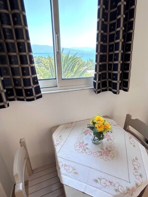 Apartment, 3 Bedrooms | Living area | 32-inch flat-screen TV with digital channels, TV, books - Bay Holiday Hotel & Spa (Stylida)