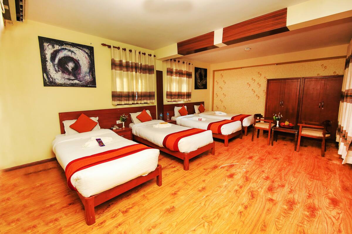 Deluxe Quadruple Room, Multiple Beds, Non Smoking | Select Comfort beds, in-room safe, desk, blackout drapes