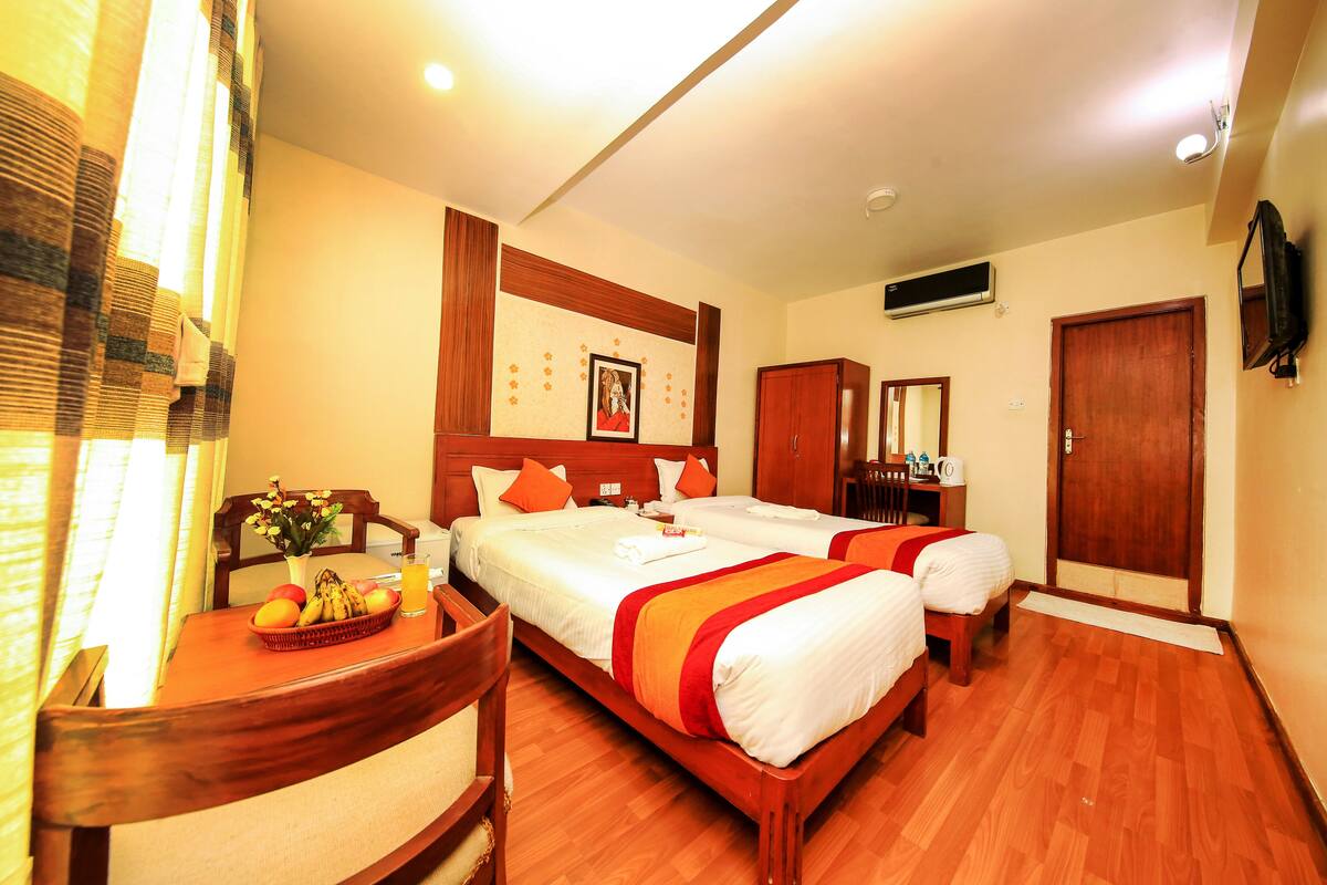 Deluxe Double or Twin Room, 2 Twin Beds, Non Smoking | Living room | 32-inch LED TV with satellite channels, TV, toys
