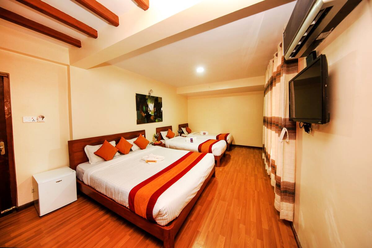 Deluxe Triple Room, Multiple Beds, Non Smoking | Select Comfort beds, in-room safe, desk, blackout drapes