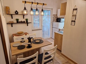 Apartment, 1 Bedroom, Balcony | Private kitchen | Fridge, stovetop, coffee/tea maker, electric kettle