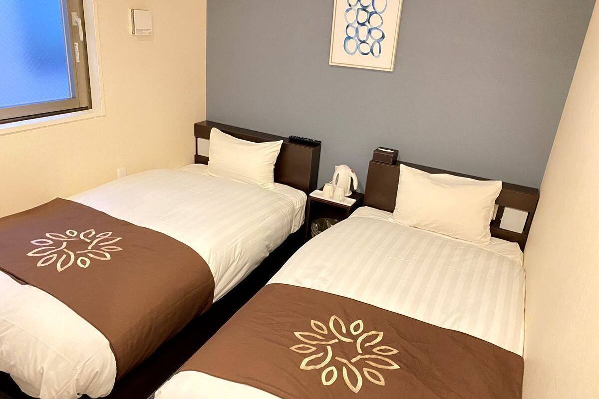 Chambre Affaires avec lits jumeaux, 2 lits une place, non-fumeur, vue ville