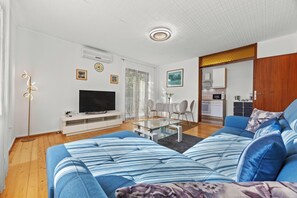 Apartment, 2 Bedrooms, Balcony | Living area | Flat-screen TV