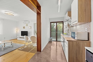 Apartment, 2 Bedrooms, Balcony | Living area | Flat-screen TV