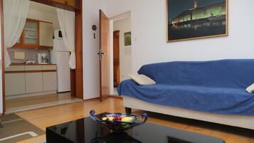 Apartment, 2 Bedrooms, Balcony | Living area | Flat-screen TV