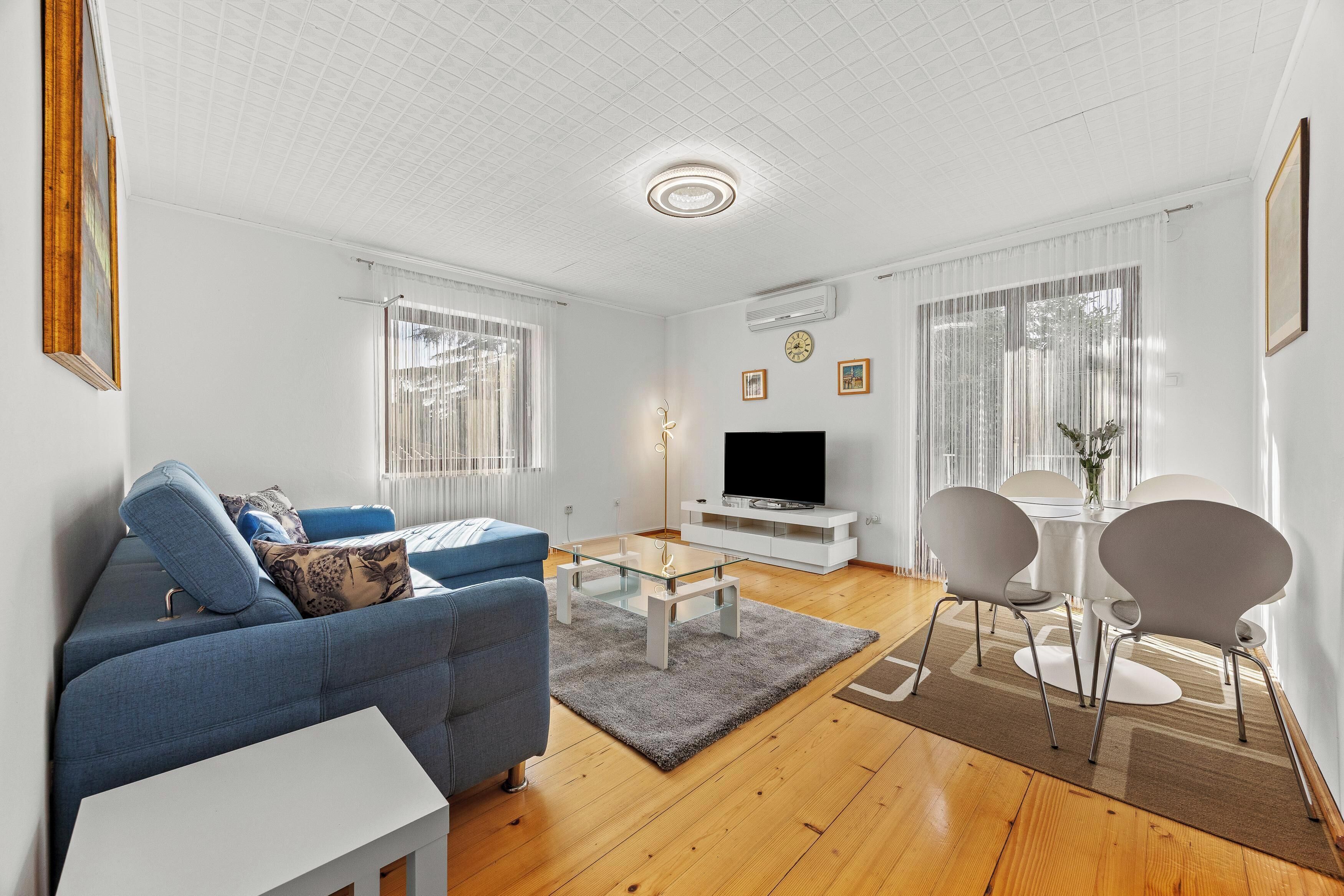 Apartment, 2 Bedrooms, Balcony | Living area | Flat-screen TV