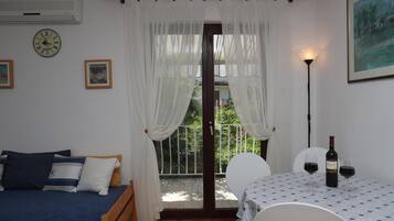 Apartment, 2 Bedrooms, Balcony | Living area | Flat-screen TV