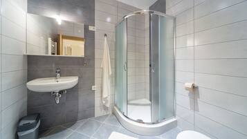 Apartment (Orange) | Bathroom | Hair dryer, slippers, towels, soap