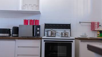 Apartment, 2 Bedrooms | Private kitchen | Fridge, microwave, stovetop, electric kettle