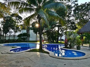 Outdoor pool, open 7:00 AM to 10:00 PM, sun loungers