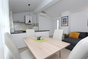 Apartment, 1 Bedroom | Private kitchen | Fridge, stovetop, coffee/tea maker, electric kettle