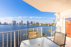 Enjoy breathtaking views of the city skyline from this spacious balcony.
