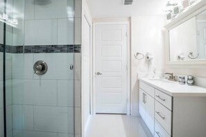 Bathtub, hair dryer, shampoo