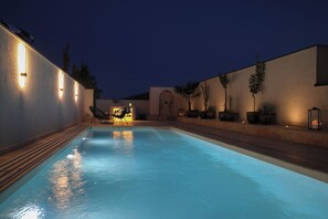 Seasonal outdoor pool, pool umbrellas, pool loungers