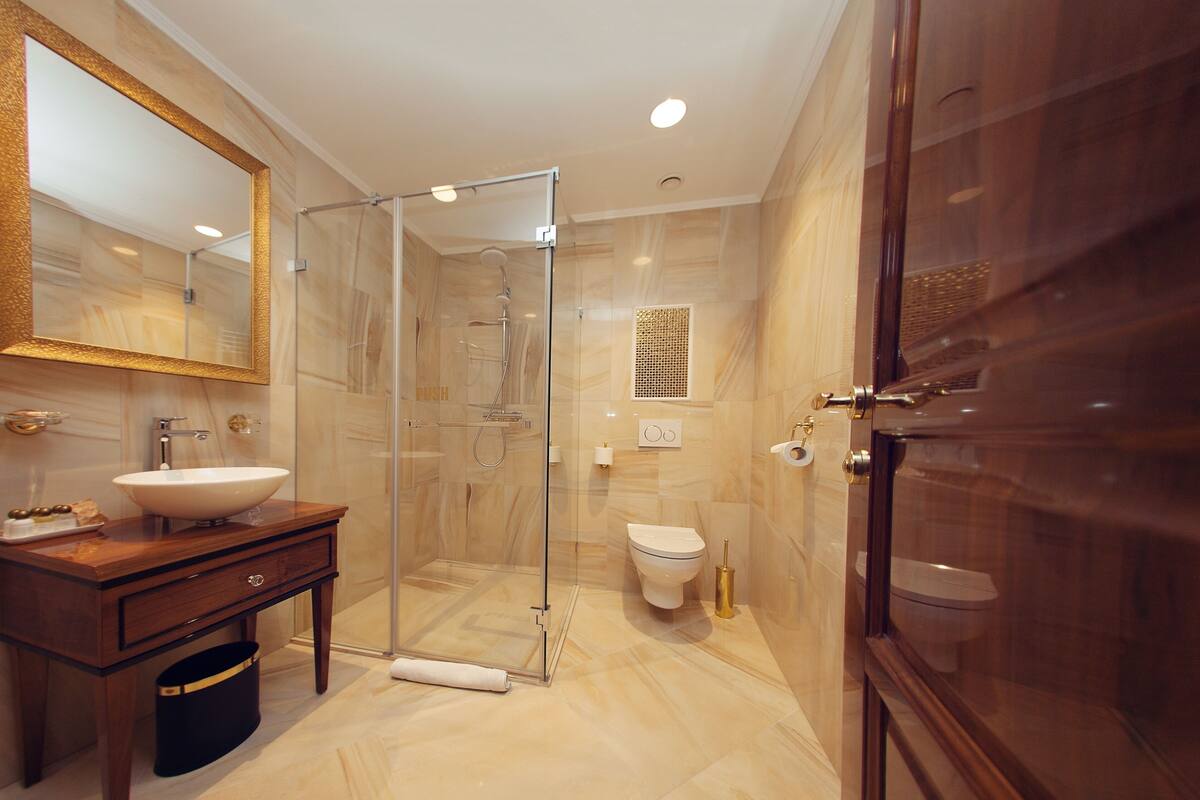exclusive suite, multiple beds | bathroom | shower, rainfall showerhead, free toiletries, hair dryer