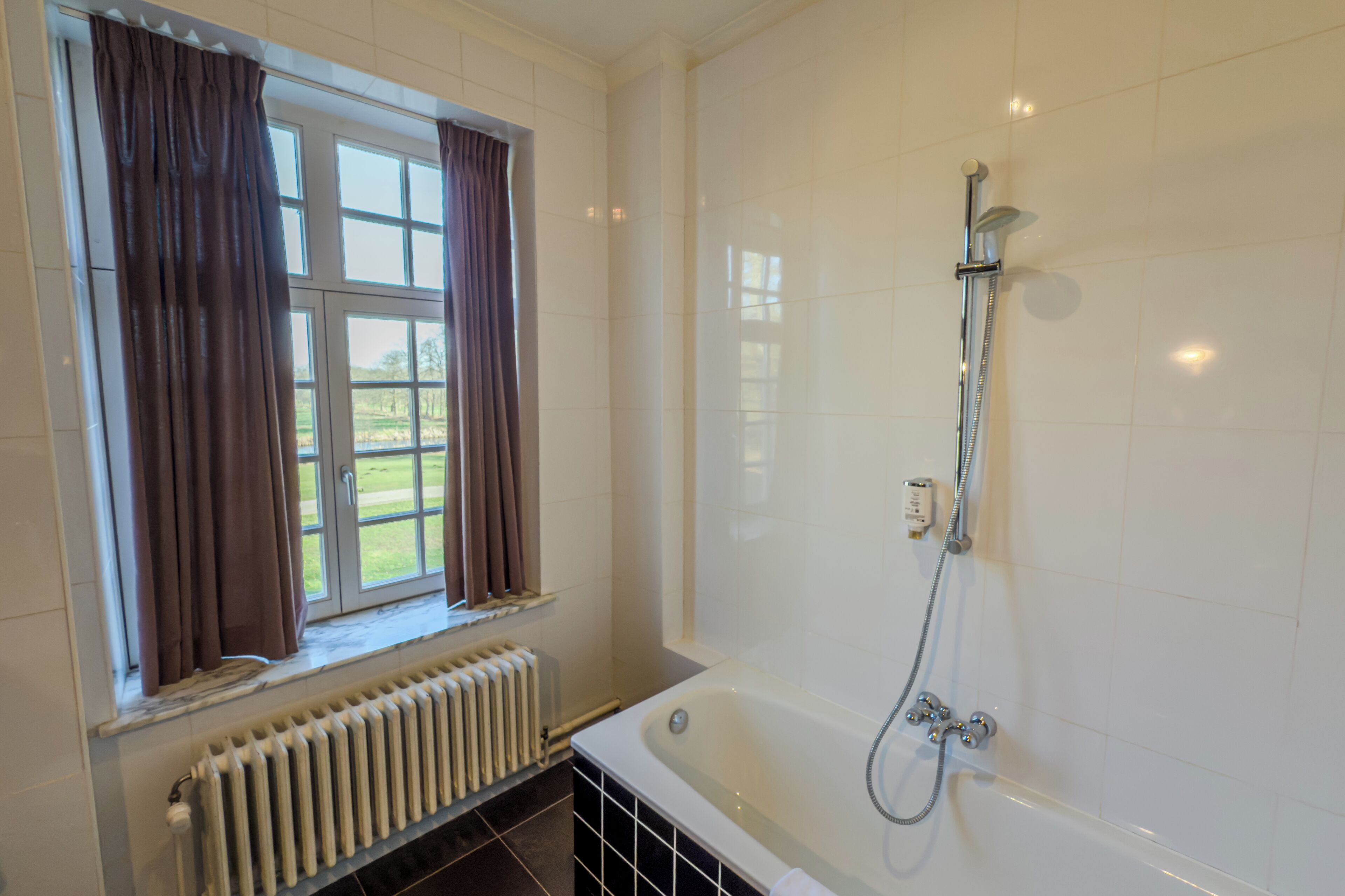 standard room | bathroom | separate bathtub and shower, deep-soaking bathtub, designer toiletries