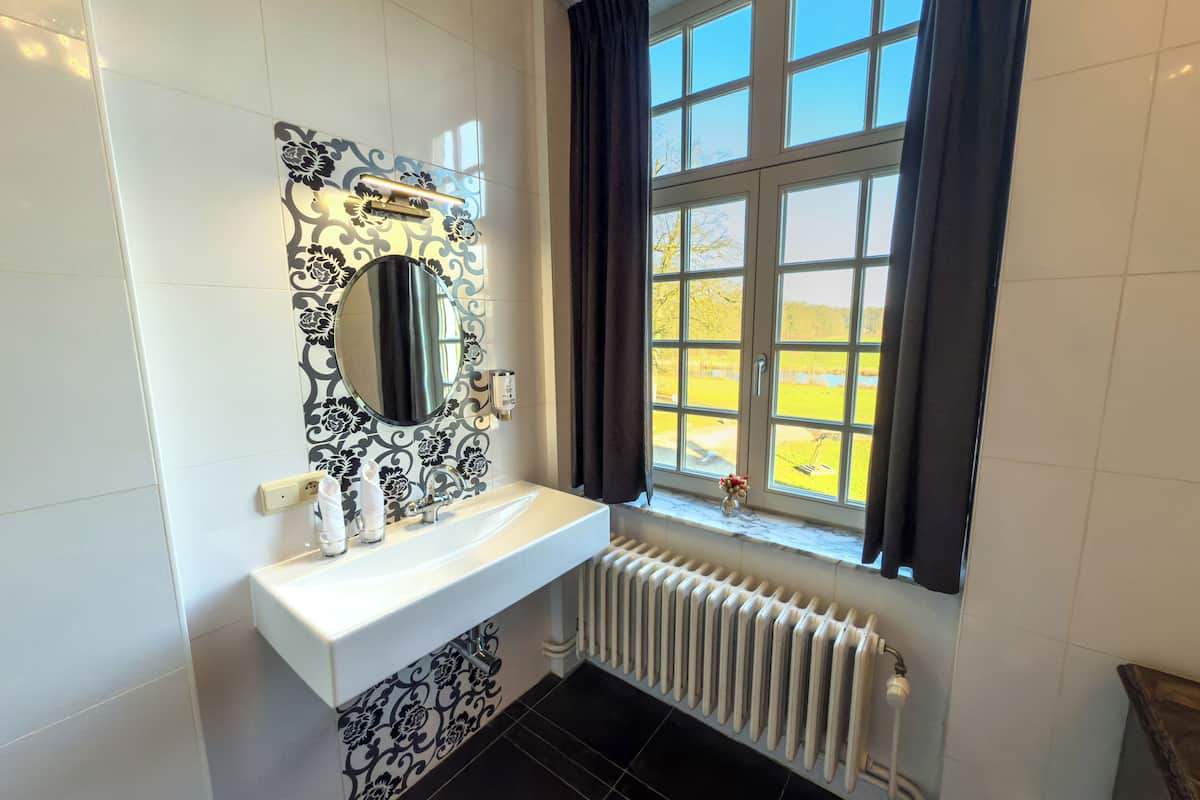 separate bathtub and shower, deep-soaking bathtub, designer toiletries