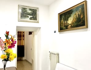 Family Apartment, 4 Bedrooms, Kitchen, City View | Living area | Flat-screen TV, heated floors - Colosseum luxury room (Rome)