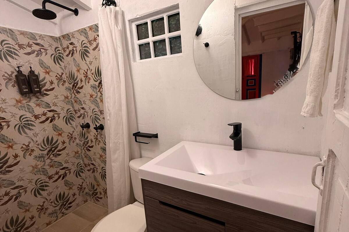 traditional quadruple room | bathroom | shower, rainfall showerhead, towels