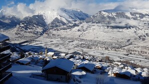 A snow-covered mountain village with traditional wooden houses and a church. - Mayens de l'Ours DZ 130 - MOUNTAIN apartment 8 per (Les Agettes)