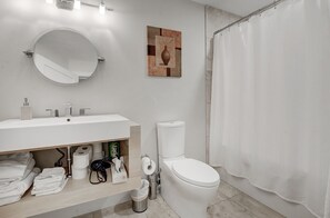 Bathtub, hair dryer, towels, soap