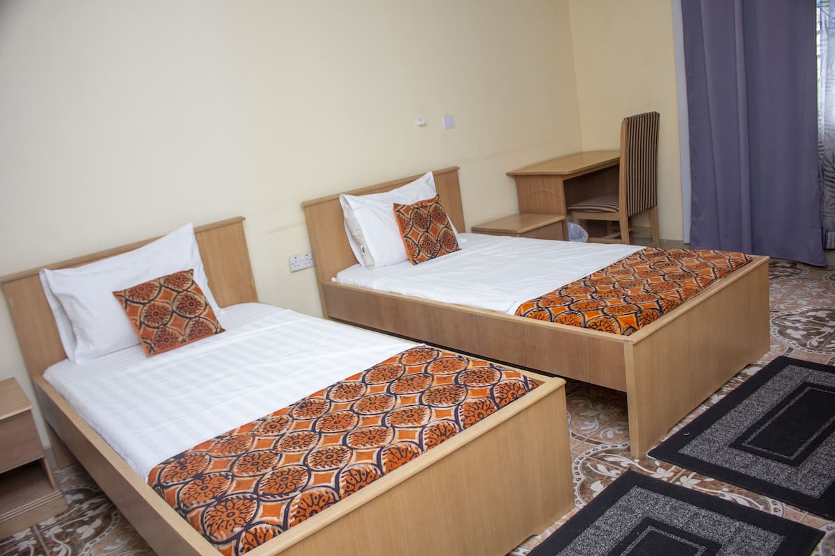 Standard Twin Room, Non Smoking | Desk, laptop workspace, blackout curtains, iron/ironing board