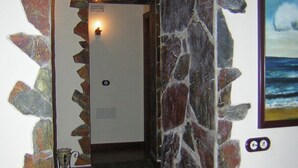 A stone archway leading to a room with a view of the ocean. - Casa rural Villa Caya for 4 people (Orotava (La))