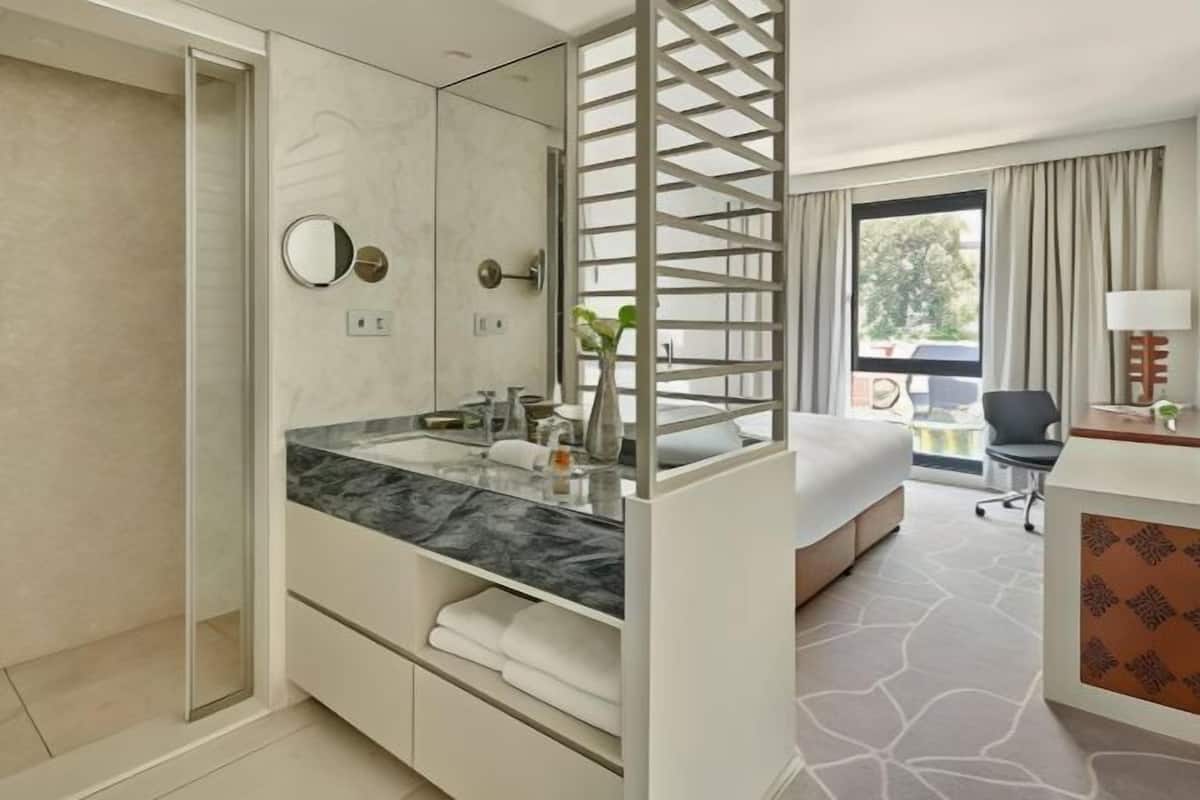 Hypo-allergenic bedding, free minibar, in-room safe, desk