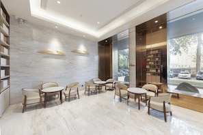 A modern lobby with marble flooring, wooden chairs, and bookshelves. - Ji Hotel (Huai'an)