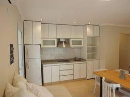 Full-size fridge, microwave, stovetop, toaster