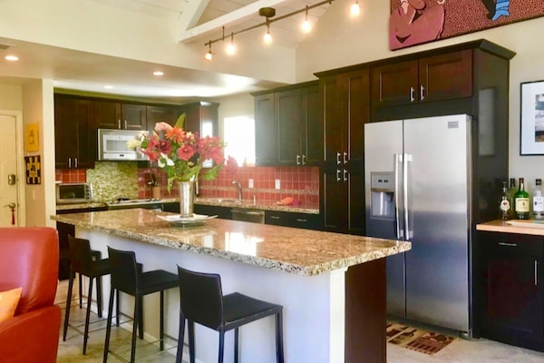 Kitchen 16 foot granite island condo is 1200 sq ft 2bed 3 bth Upper Unit. Quiet