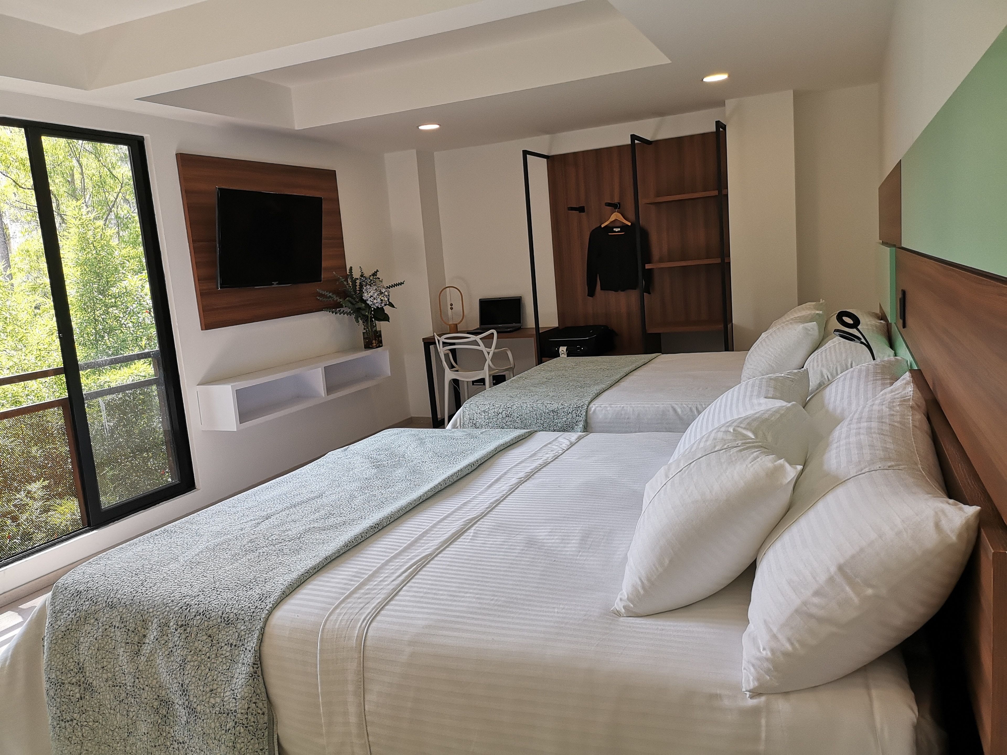 family room, 2 queen beds, non smoking | premium bedding, minibar, in-room safe, desk